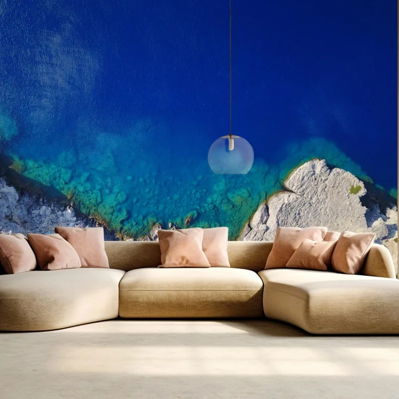 Carta da parati costa rocciosa e mare turchese visti dall'alto