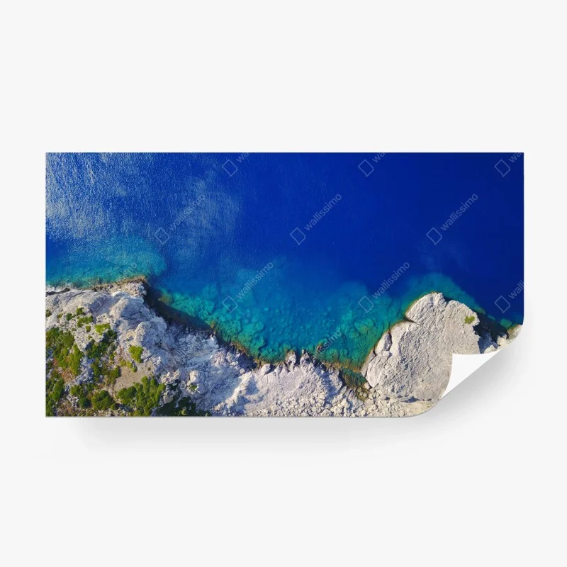 Carta da parati costa rocciosa e mare turchese visti dall'alto