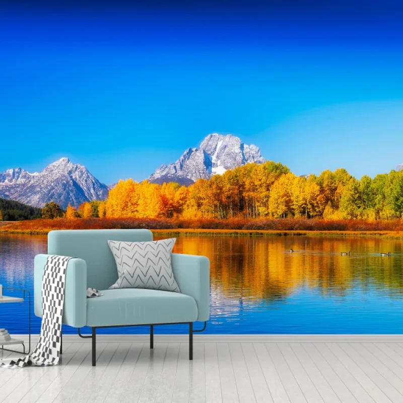 Carta da parati panoramica autunnale sul lago con montagne innevate