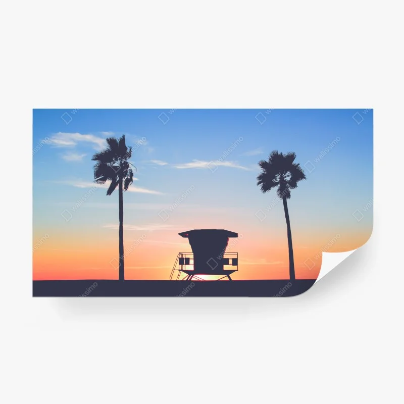 Carta da parati tramonto tropicale con torretta di salvataggio