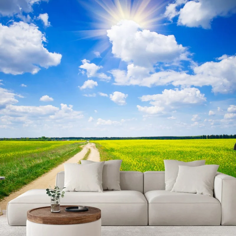 Carta da parati campo di colza sotto il cielo azzurro