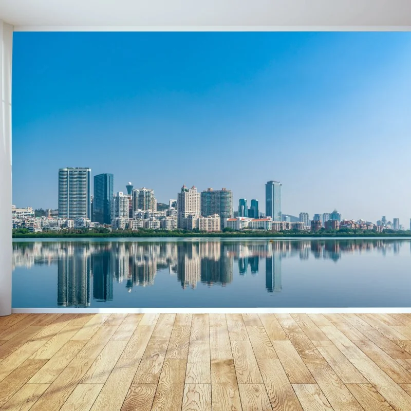 Carta da parati orizzonte urbano con riflessi sul lago