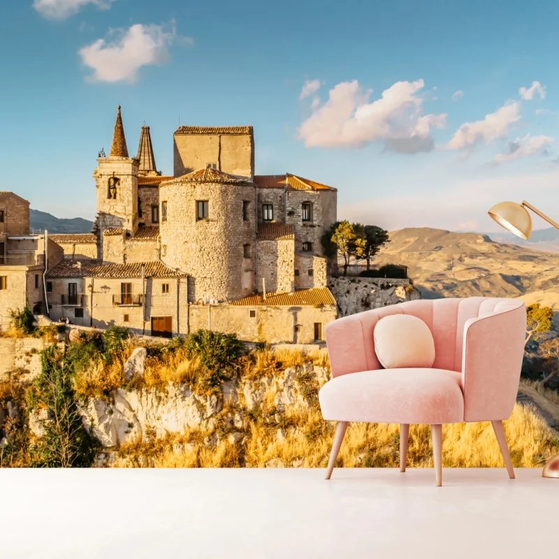 Carta da parati borgo medievale arroccato sul dirupo al tramonto