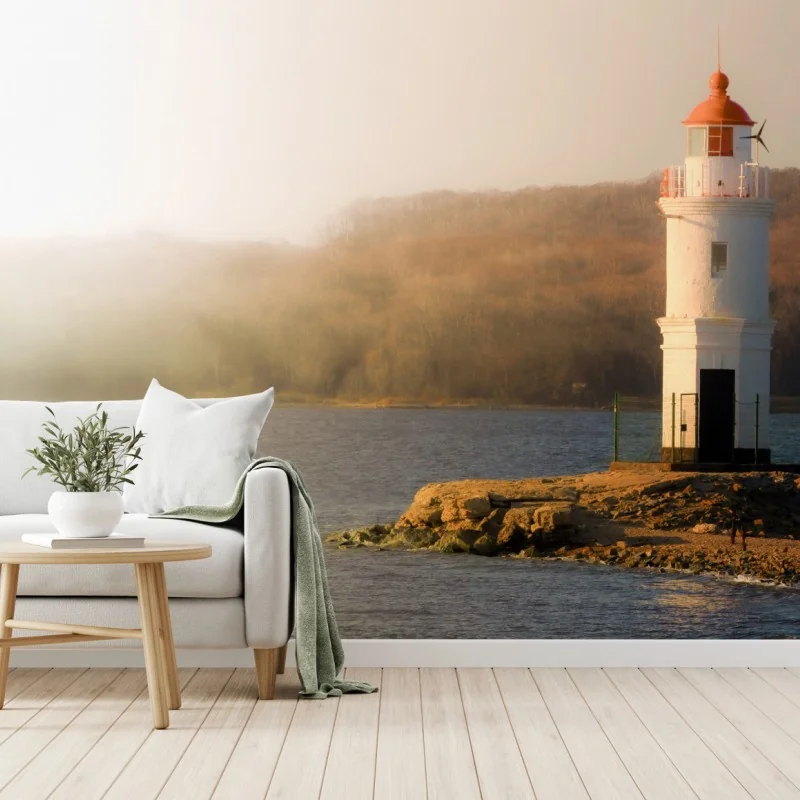 Carta da parati faro al tramonto su costa rocciosa