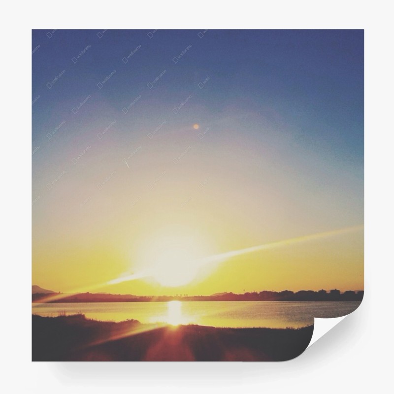 Carta da parati tramonto dorato sul lago