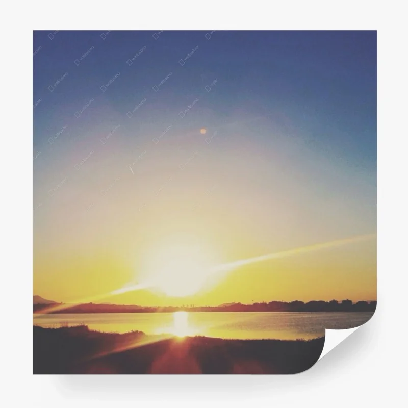 Carta da parati tramonto dorato sul lago